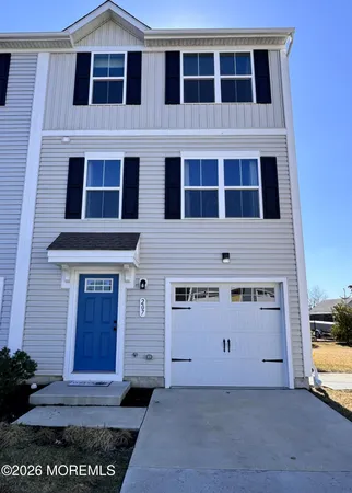 a view of front door of house with a yard