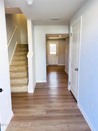 a kitchen with a sink a stove top oven a counter space and cabinets