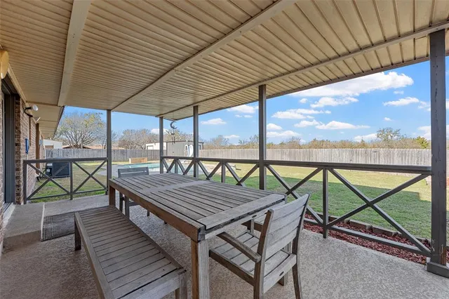 a wooden bench sitting at roof deck