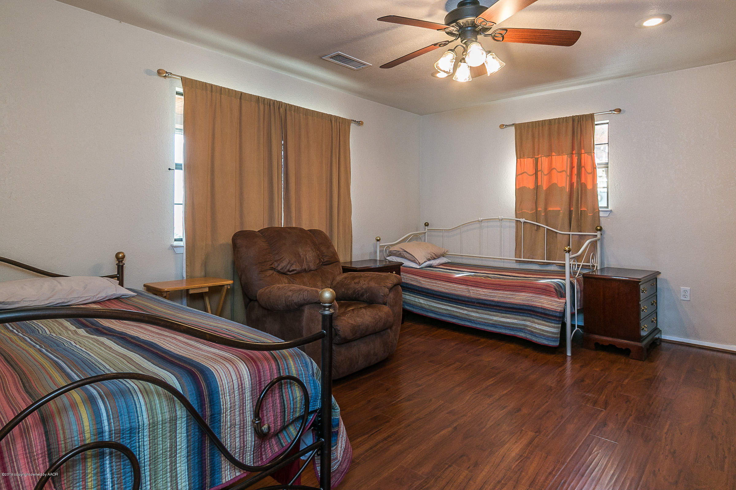 13400 Rachel Road Amarillo, TX 79118 - Photo 18 of 42 a bedroom with a bed and wooden floor