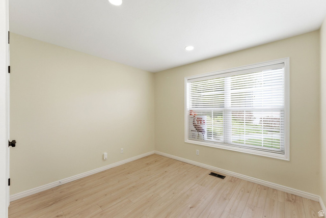 1041 West Grindelwald Court, Unit R5 Midway, UT 84049 - Photo 20 of 44 Well-sized bedroom with practical storage and a simple, calming layout. Featuring light wood-type flooring and recessed lighting.
