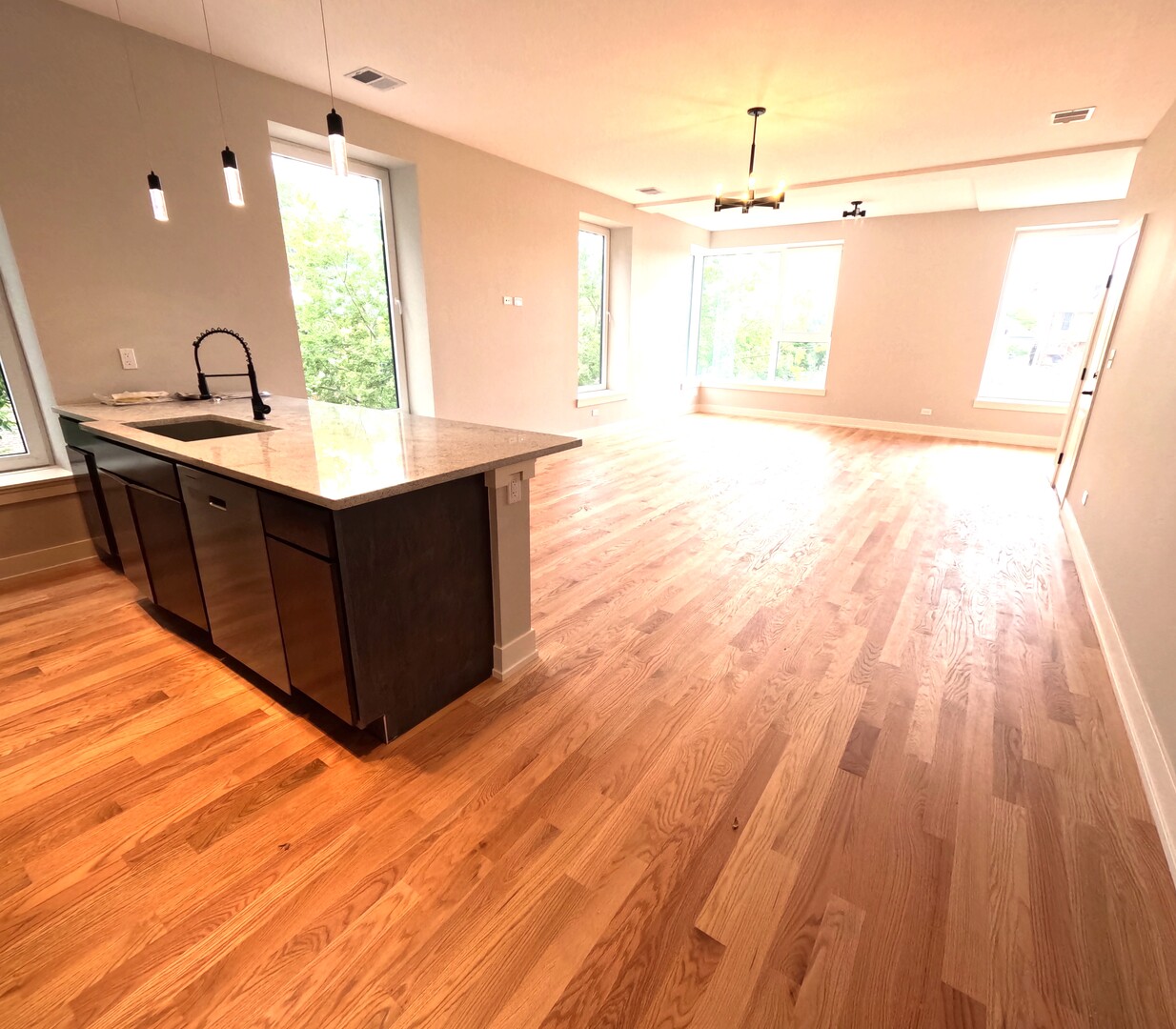 2100 West 18th Place, Unit 401 Chicago, IL 60608 - Photo 5 of 13 a kitchen with wooden cabinets and sink