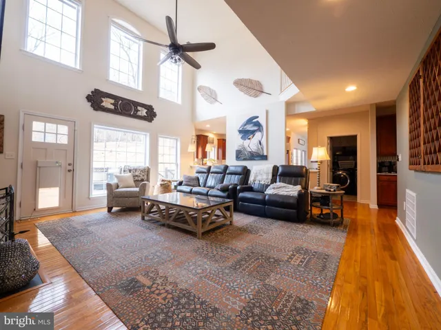 a kitchen with stainless steel appliances granite countertop a refrigerator stove top oven and sink