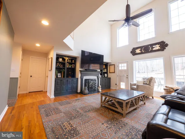 a kitchen with granite countertop a refrigerator and a stove top oven