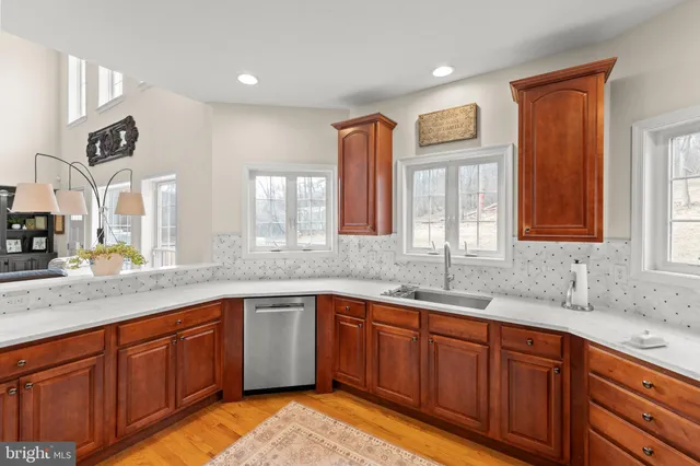 a kitchen with stainless steel appliances wooden cabinets and a counter top space