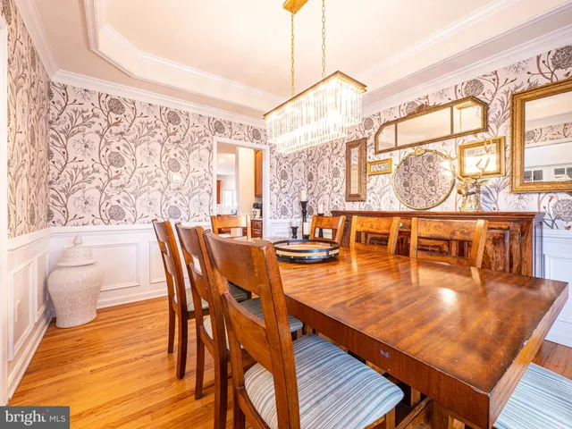 a living room with furniture and a large window with outer view