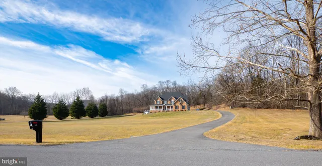 a view of swimming pool with an outdoor space and seating area