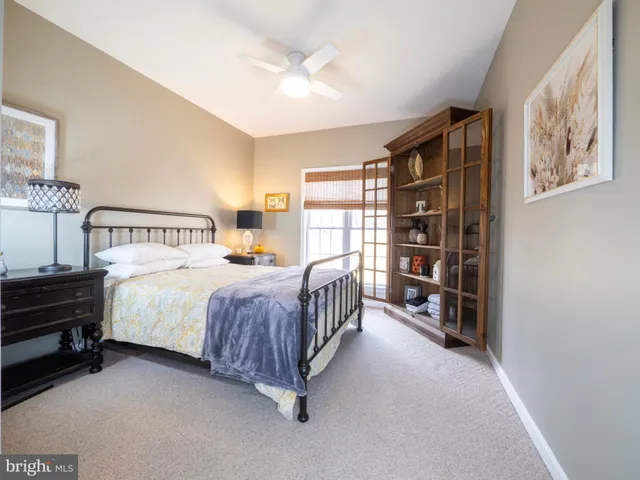 a spacious bathroom with a sink a mirror and bathtub