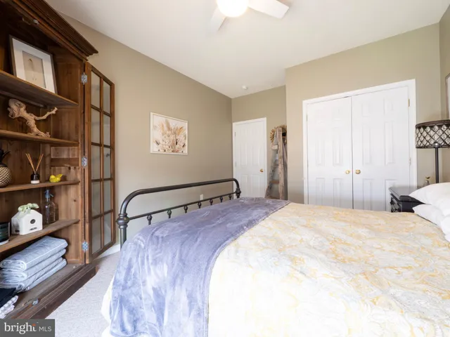 a bathroom with a tub sink shower and mirror