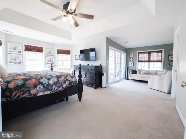 a bedroom with two beds and painted walls