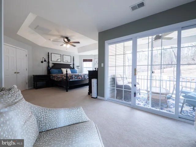 a white toilet sitting next to a shower curtain