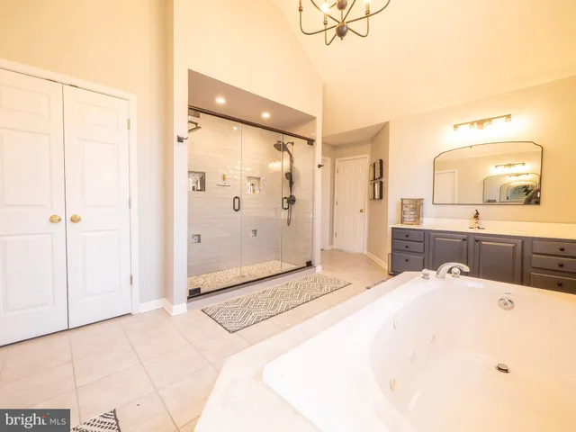 a bedroom with a bed and a television