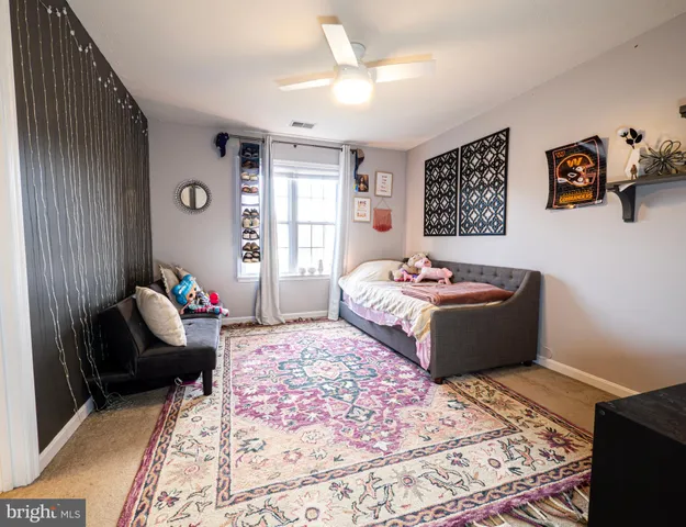 a bathroom with a toilet a sink and a mirror
