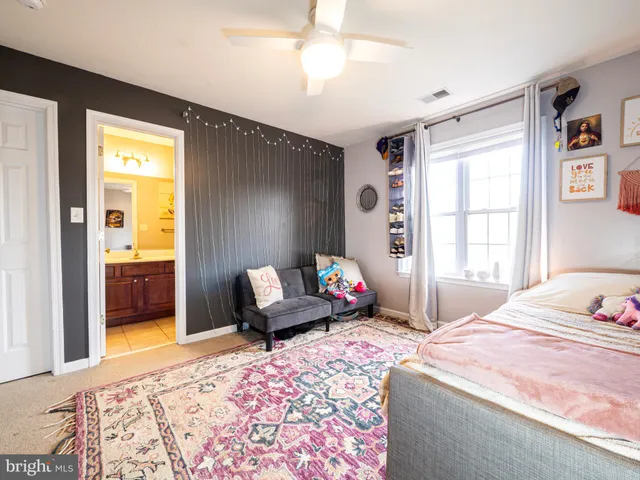 a bathroom with a toilet sink and shower