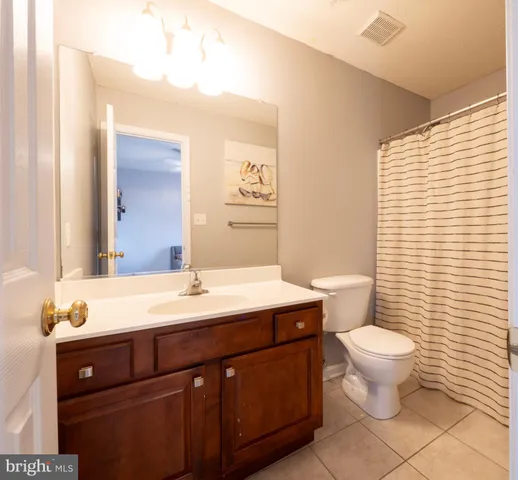 a bedroom with a bed and cabinets