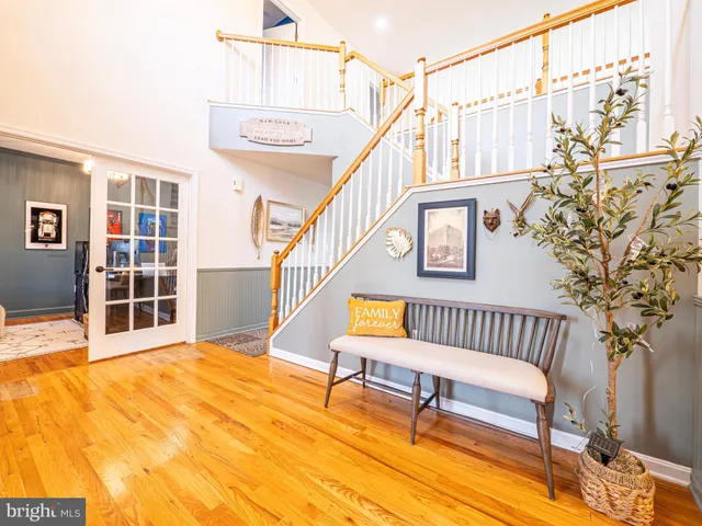 a large kitchen with kitchen island a sink stainless steel appliances and cabinets