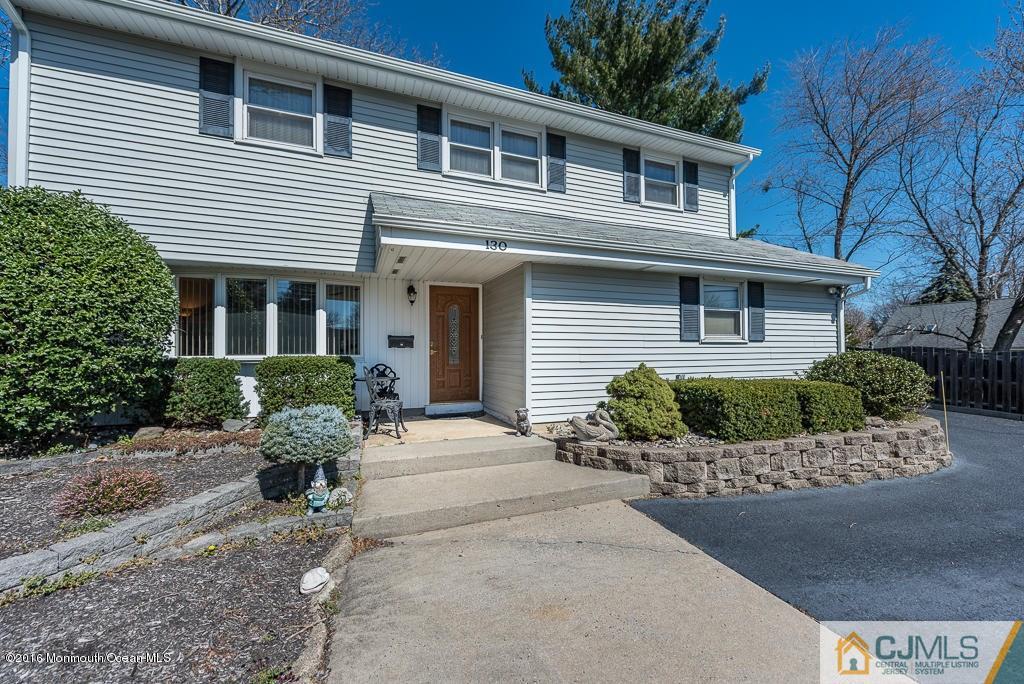 130 Bethany Road Hazlet, NJ 07730 - Photo 2 of 24 a front view of a house with a yard