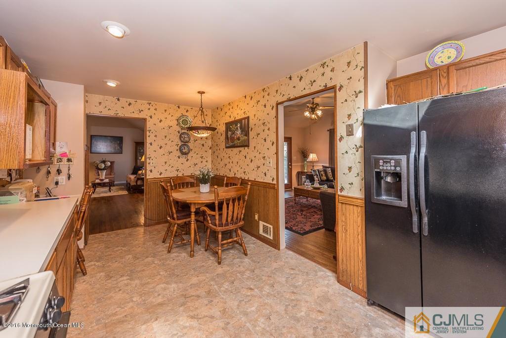 130 Bethany Road Hazlet, NJ 07730 - Photo 12 of 24 a dining hall with stainless steel appliances a dining table and chairs