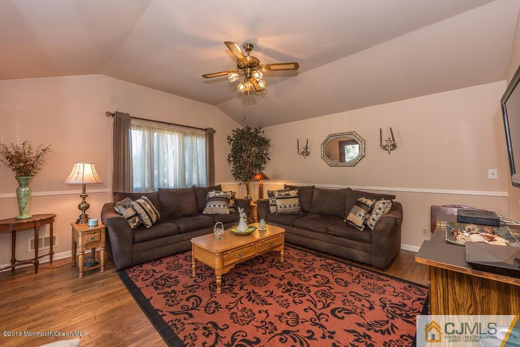 130 Bethany Road Hazlet, NJ 07730 - Photo 13 of 24 a living room with furniture and a rug