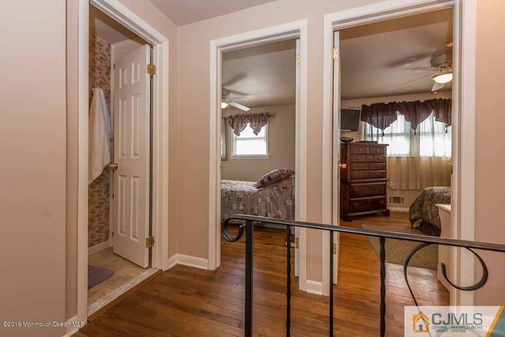 130 Bethany Road Hazlet, NJ 07730 - Photo 19 of 24 a view of staircase with wooden floor