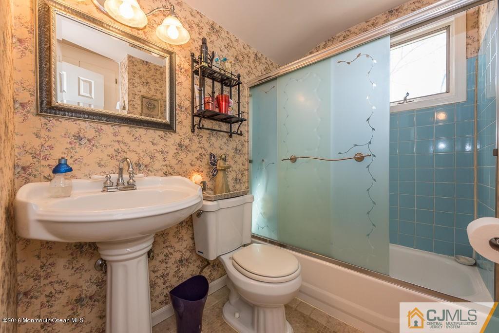 130 Bethany Road Hazlet, NJ 07730 - Photo 20 of 24 a bathroom with a sink toilet and shower