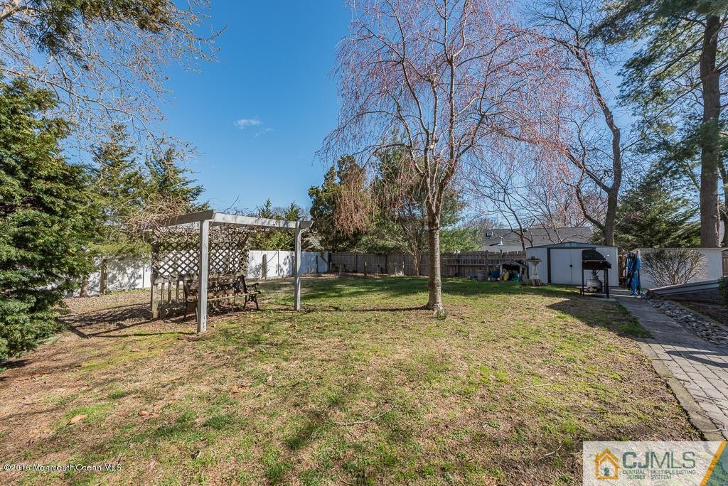 130 Bethany Road Hazlet, NJ 07730 - Photo 23 of 24 a house with trees in front of it