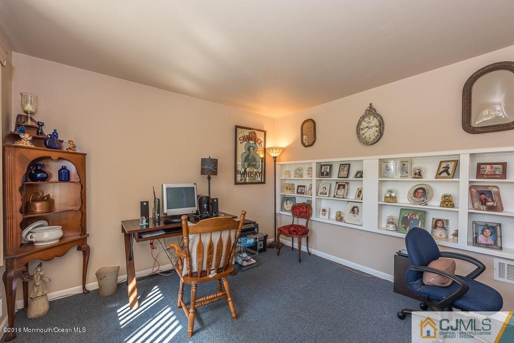 130 Bethany Road Hazlet, NJ 07730 - Photo 5 of 24 a view of a workspace with furniture and toys