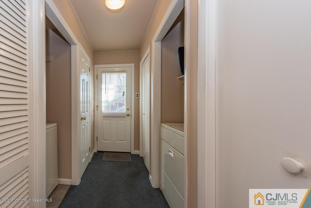 130 Bethany Road Hazlet, NJ 07730 - Photo 7 of 24 a view of a hallway with wooden floor