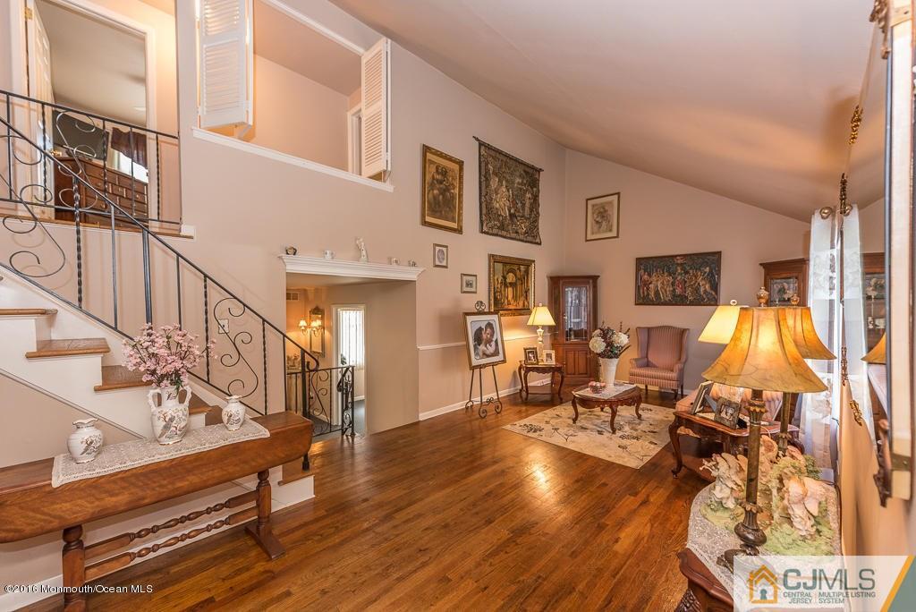 130 Bethany Road Hazlet, NJ 07730 - Photo 8 of 24 a living room with lots of furniture and wooden floor