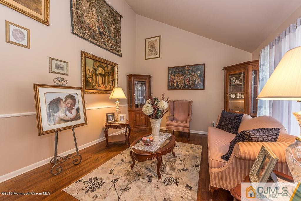 130 Bethany Road Hazlet, NJ 07730 - Photo 10 of 24 a living room with furniture and a window