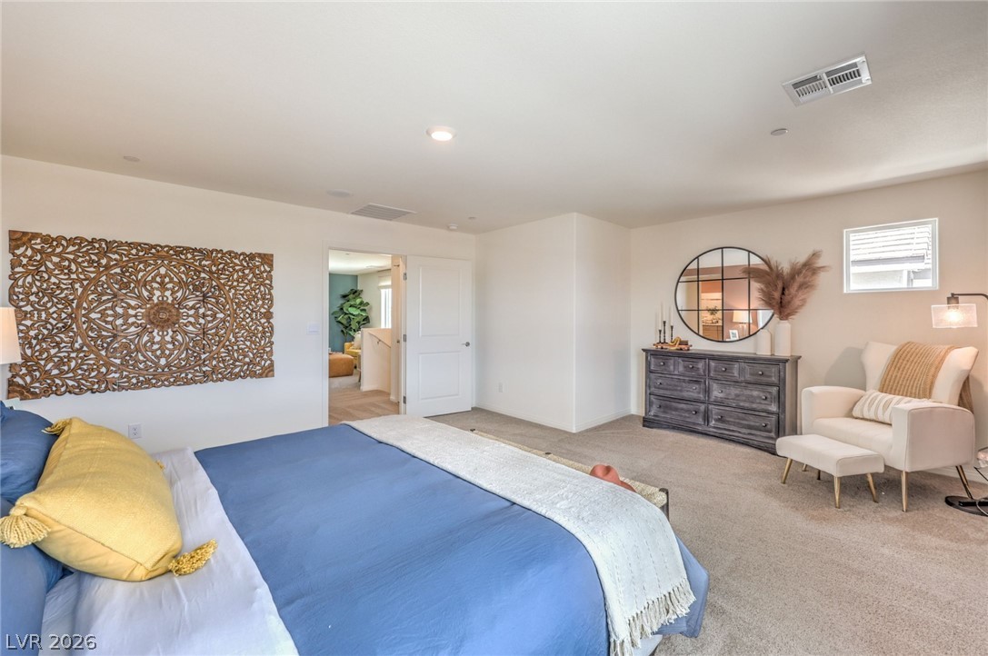 1013 Copper Robin Street Henderson, NV 89011 - Photo 20 of 43 Photo is representational only; actual home finishes may vary. View of carpeted bedroom
