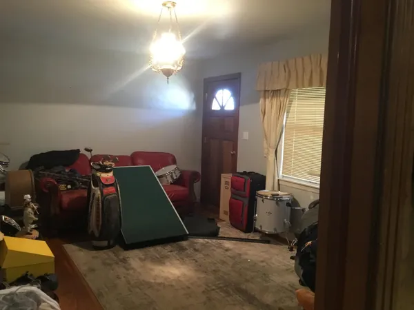 a bedroom with bed and window