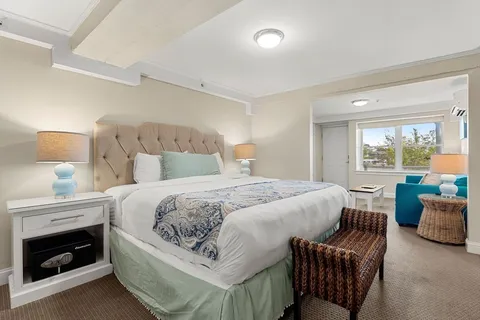 a bedroom with a bed and a couch