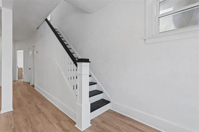 a view of entryway with wooden floor