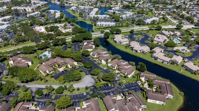an aerial view of residential houses with outdoor space