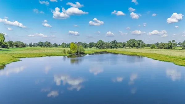 a view of lake with green space