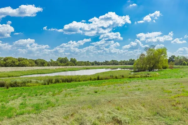 a view of a golf course with a lake