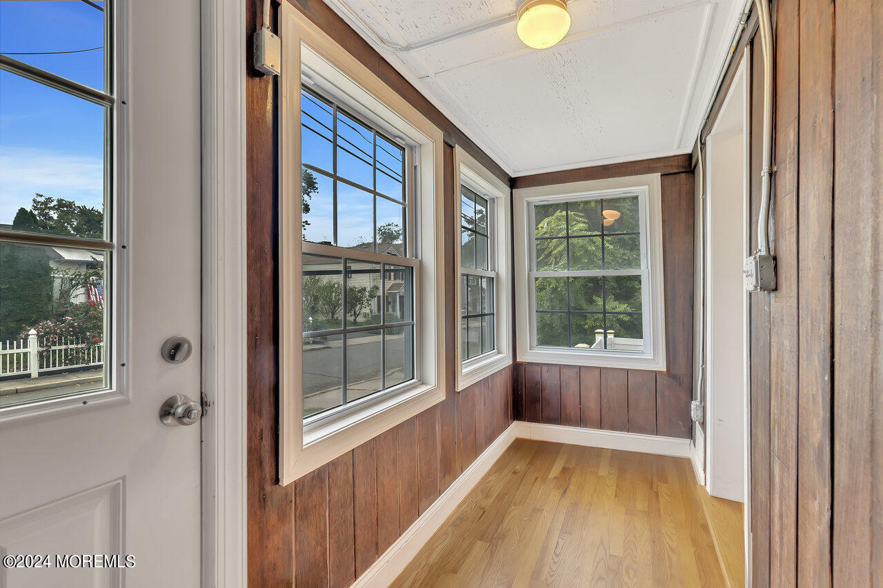 164 Jackson Street Matawan, NJ 07747 - Photo 16 of 26 a view of an empty room with wooden floor and a window