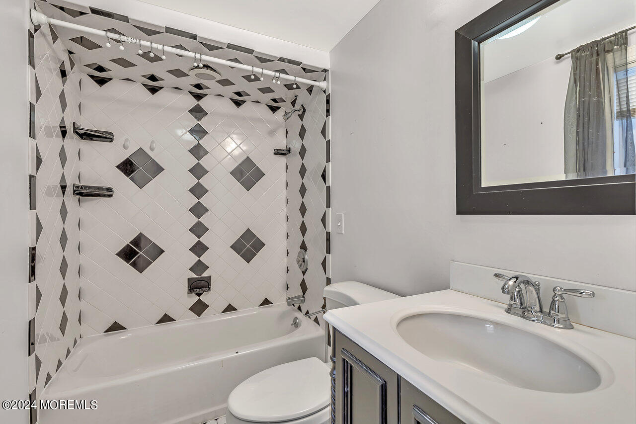 164 Jackson Street Matawan, NJ 07747 - Photo 17 of 26 a bathroom with a sink toilet a shower and a bathtub