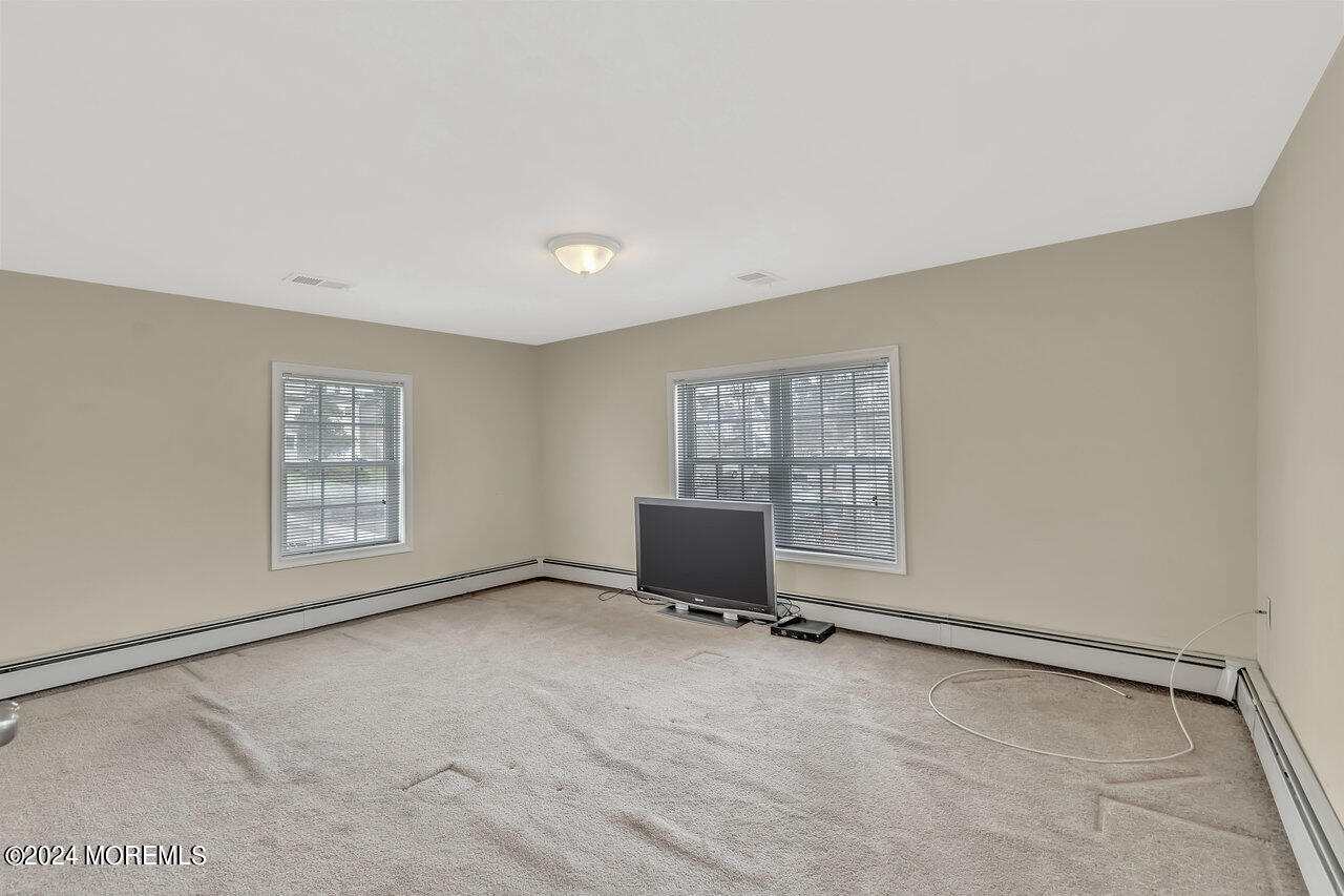 164 Jackson Street Matawan, NJ 07747 - Photo 18 of 26 a view of an empty room with a window