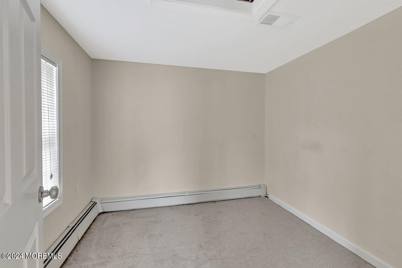 164 Jackson Street Matawan, NJ 07747 - Photo 20 of 26 a view of an empty room and window