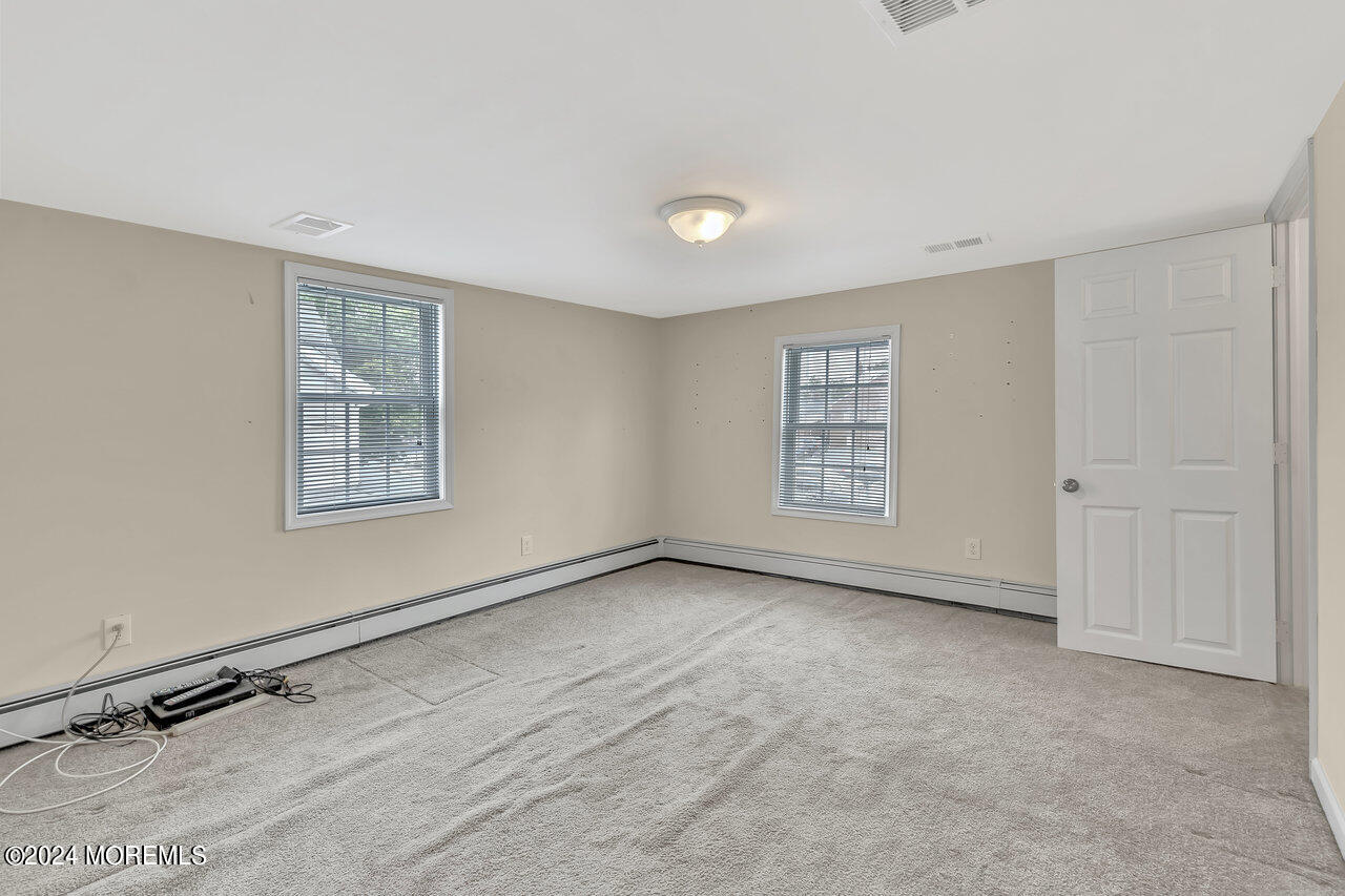 164 Jackson Street Matawan, NJ 07747 - Photo 21 of 26 a view of an empty room with a window
