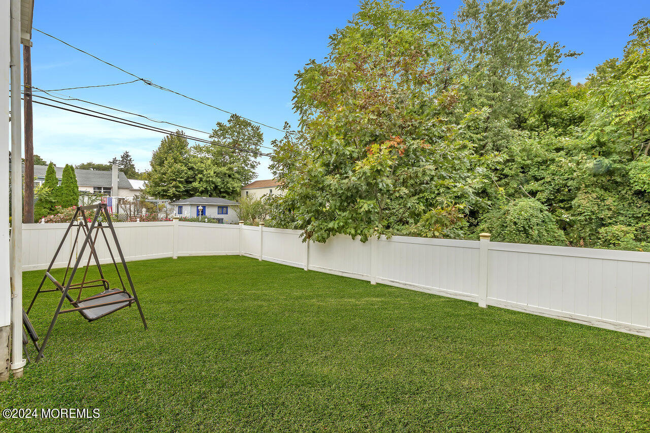 164 Jackson Street Matawan, NJ 07747 - Photo 24 of 26 a view of backyard with a table and chairs