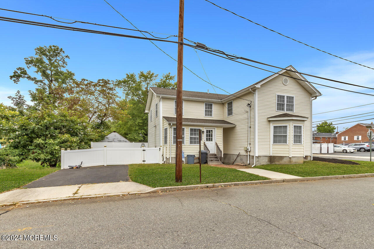 164 Jackson Street Matawan, NJ 07747 - Photo 3 of 26 a front view of a house with a yard and garage