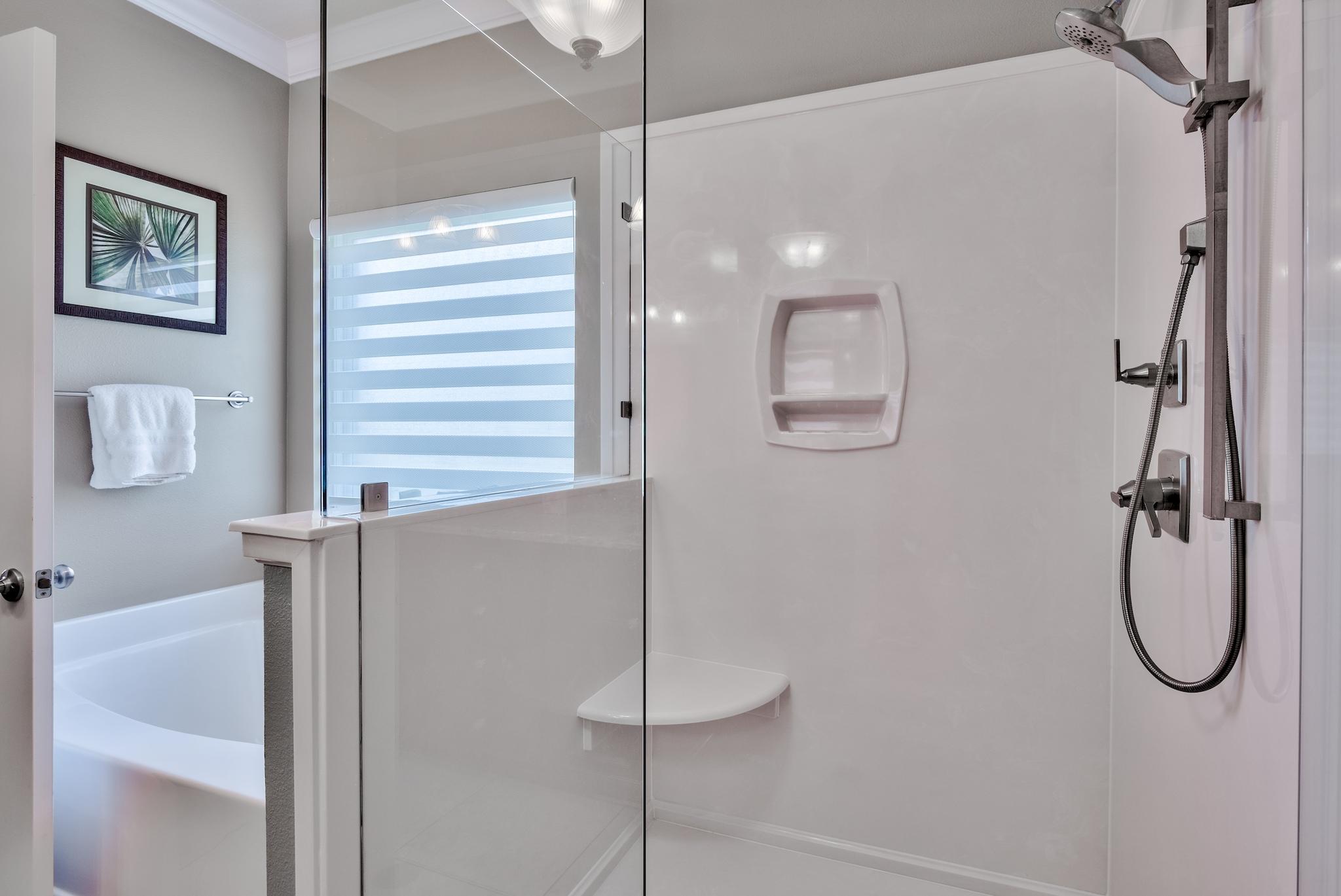 464 Pin Oak Loop Santa Rosa Beach, FL 32459 - Photo 29 of 44 a bathroom with a bath tub and a shower