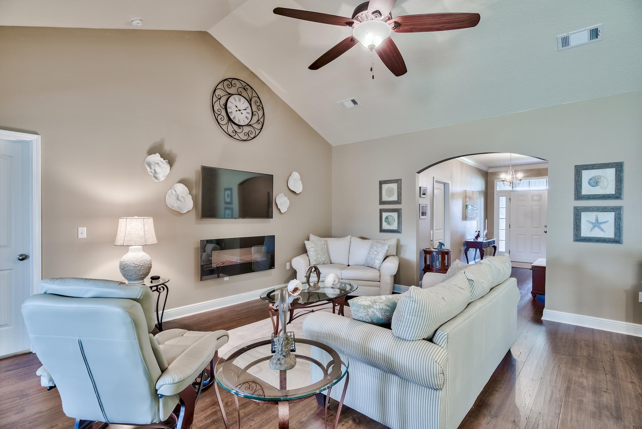 464 Pin Oak Loop Santa Rosa Beach, FL 32459 - Photo 8 of 44 a living room with furniture a fireplace and a flat screen tv
