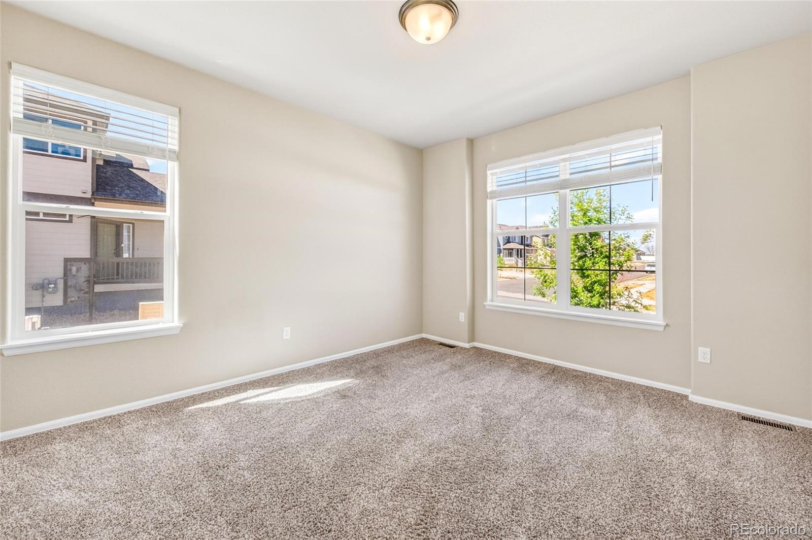 10436 17th Street Greeley, CO 80634 - Photo 12 of 18 an empty room with windows