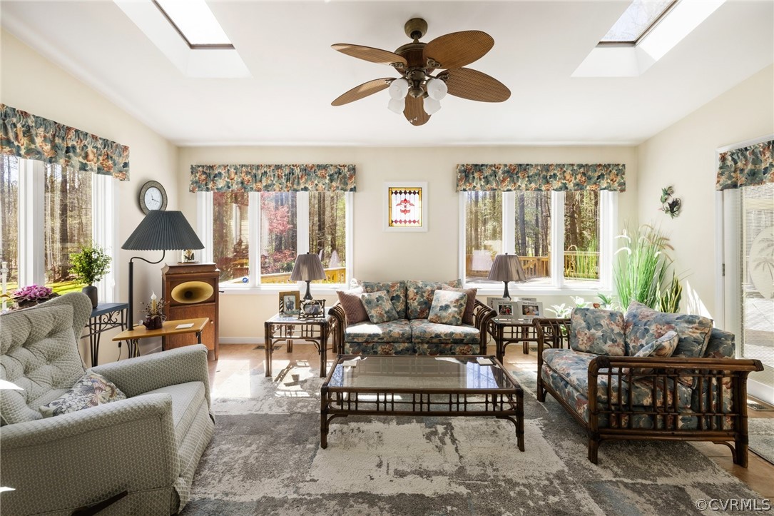 9221 Cattail Road Chesterfield, VA 23838 - Photo 16 of 34 a living room with furniture ceiling fan and a large window