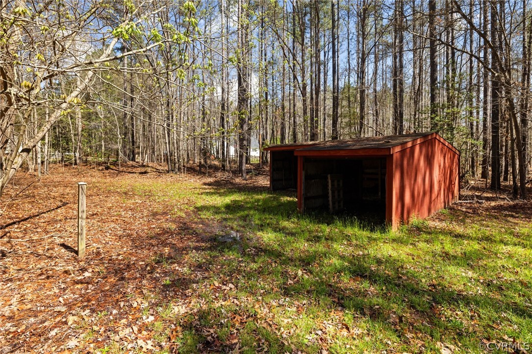 9221 Cattail Road Chesterfield, VA 23838 - Photo 33 of 34 a view of a backyard with a tree