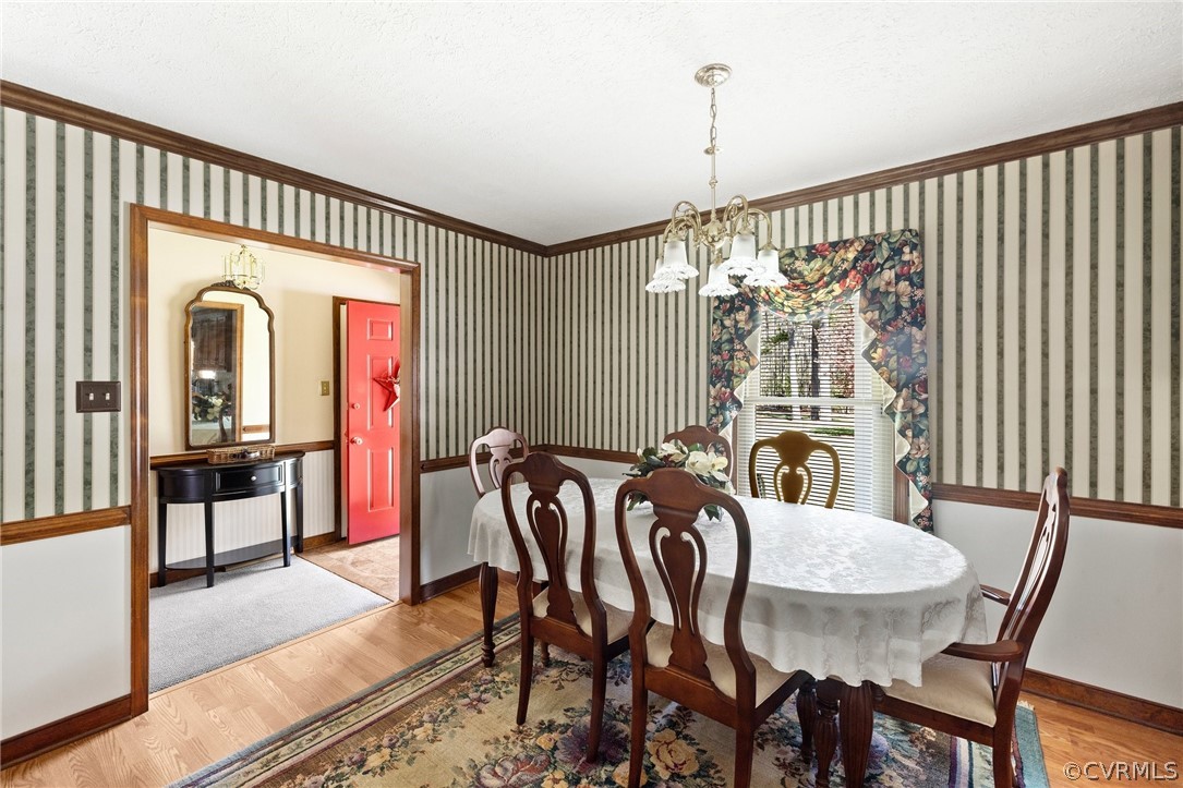 9221 Cattail Road Chesterfield, VA 23838 - Photo 8 of 34 a view of a dining room with furniture window and wooden floor